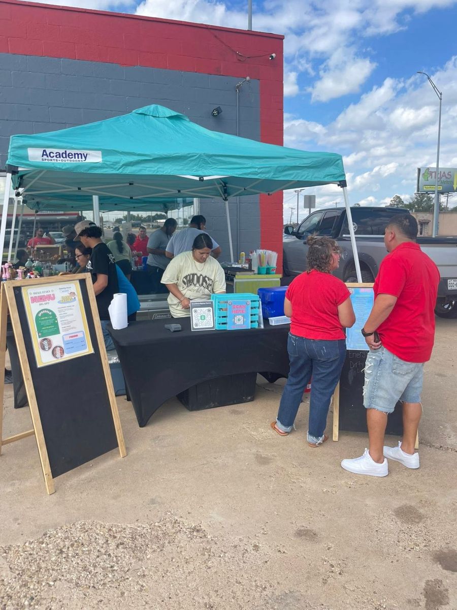 Daytime setup with customers and the menu board