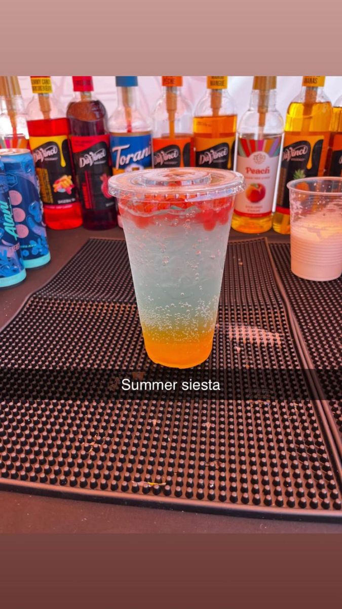 Multi-layered colorful dirty soda with fresh fruit